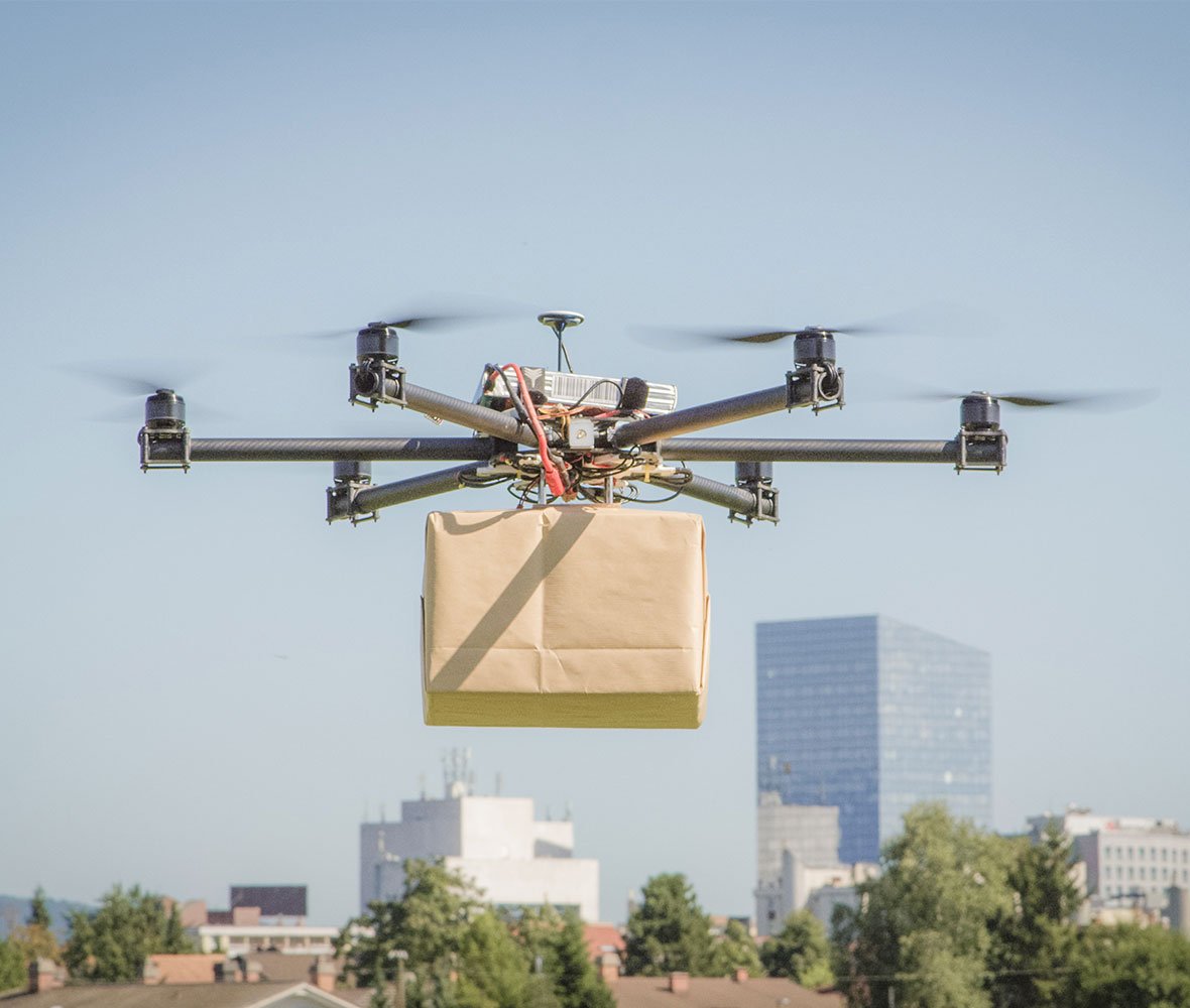 Image of drone carrying a parcel