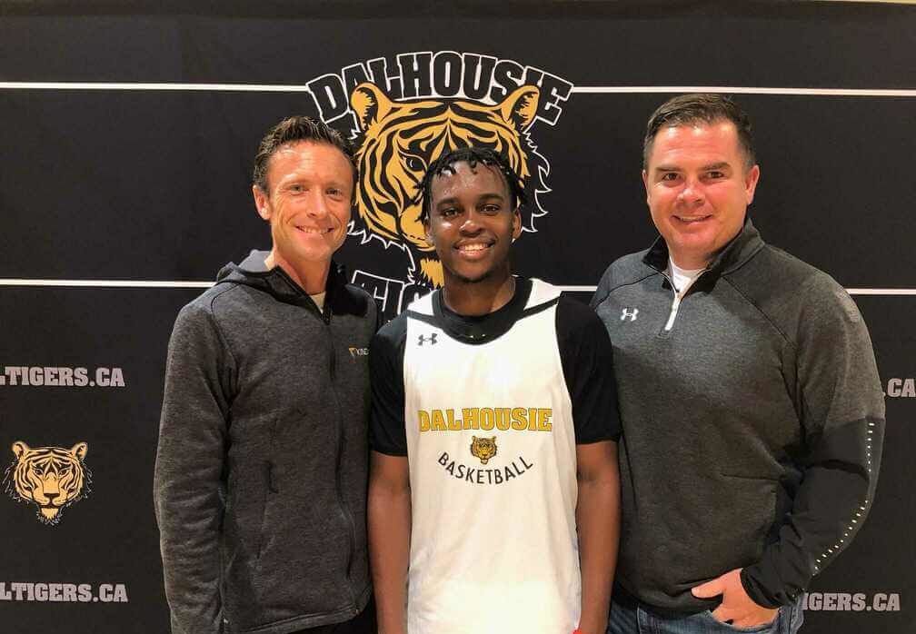 Nginyu Ngala, recipient of the Dalhousie - Kinduct scholarship, pictured with Kinduct CEO Travis McDonough and im Maloney, Executive Director of Athletics & Recreation at Dalhousie