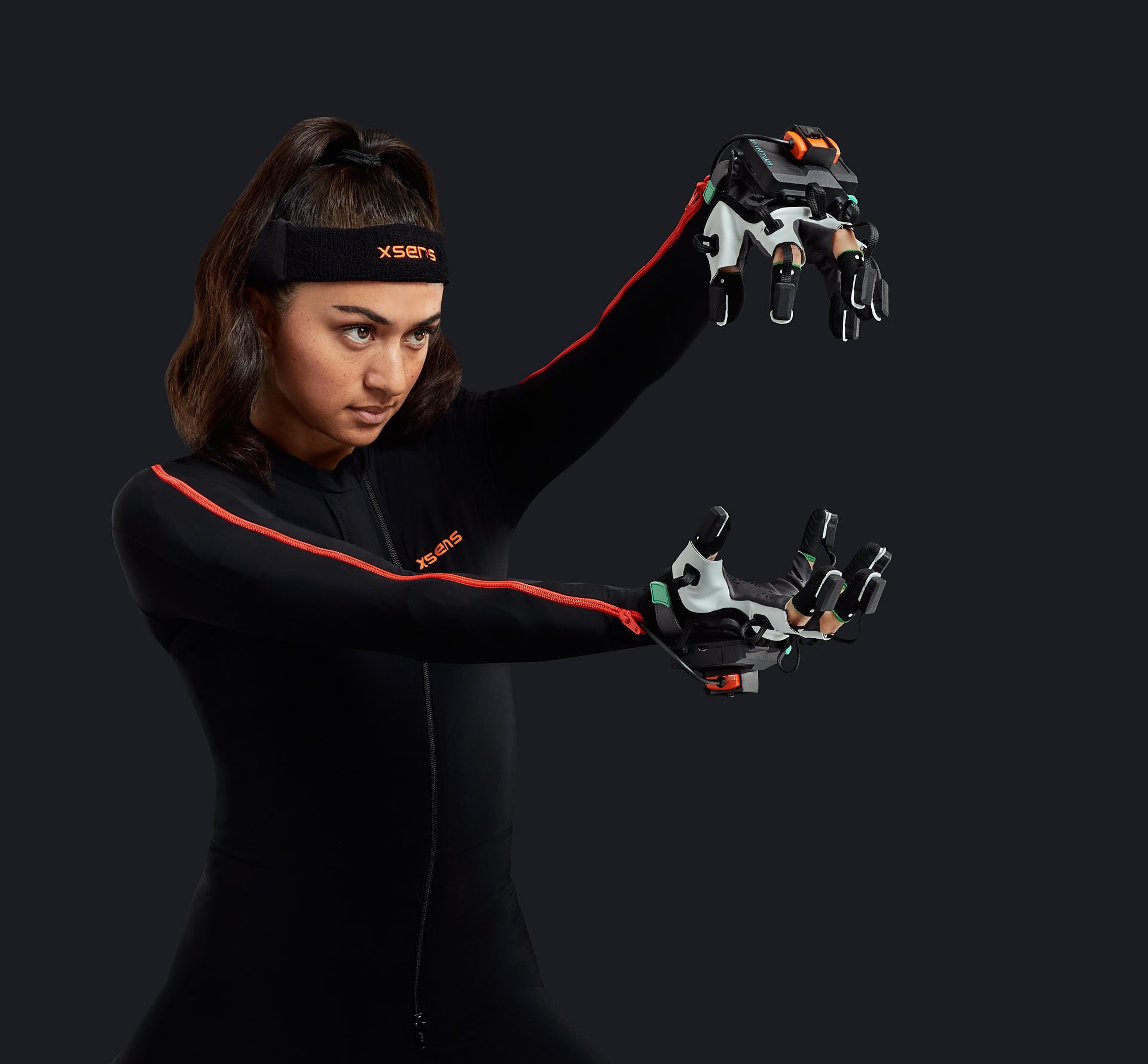Woman wearing motion capture suit with xsens gloves on