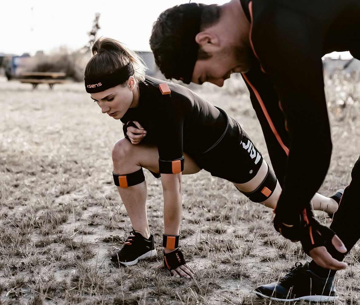 Two athletes stretching