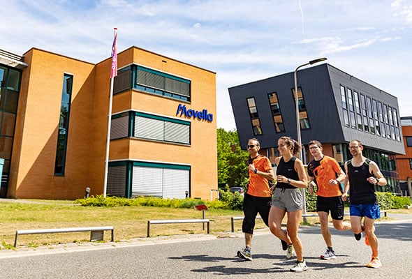Image of Movella building with a group jogging past