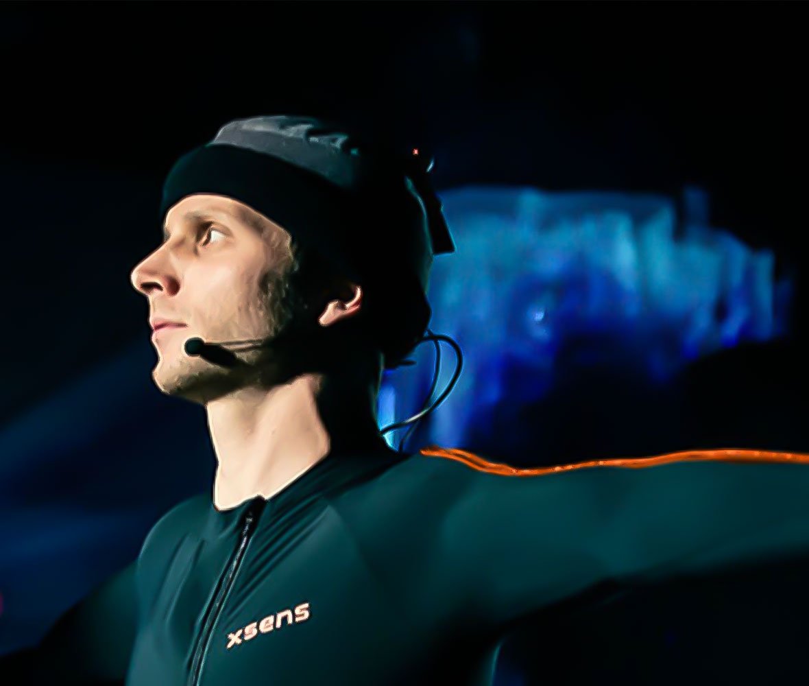 Close up of man wearing Xsens clothing and wearing a headset