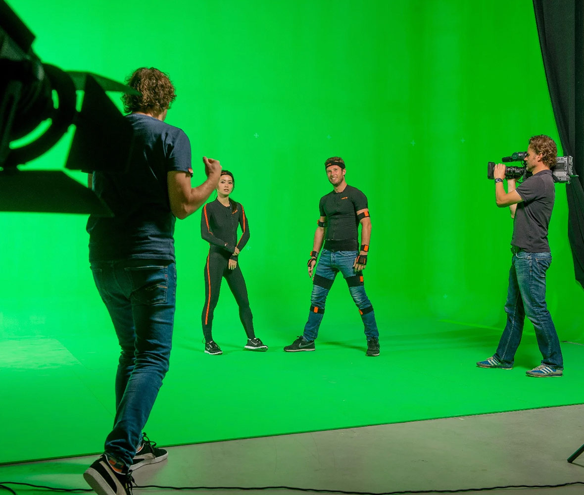Actors on set with a greenscreen