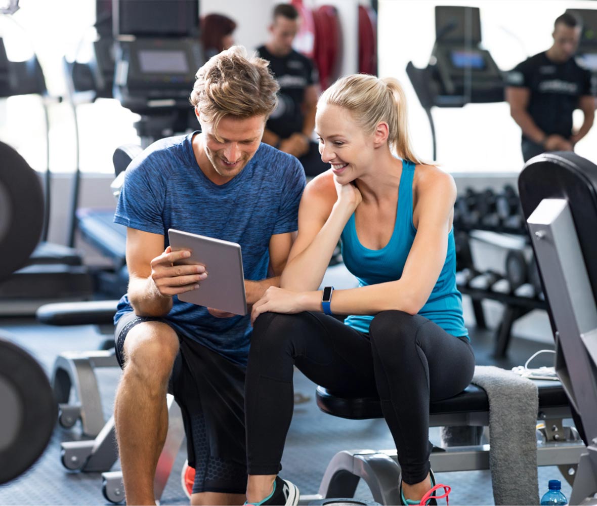 coach and athlete analyzing data