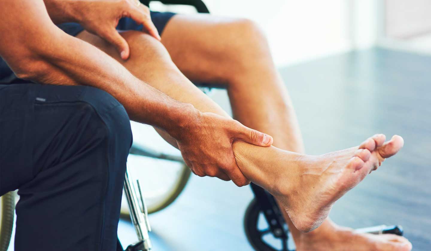 Physio holding patients ankle